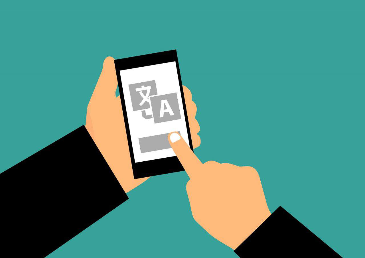 Smartphone showing a translated message, part of CCA's multilingual localization services